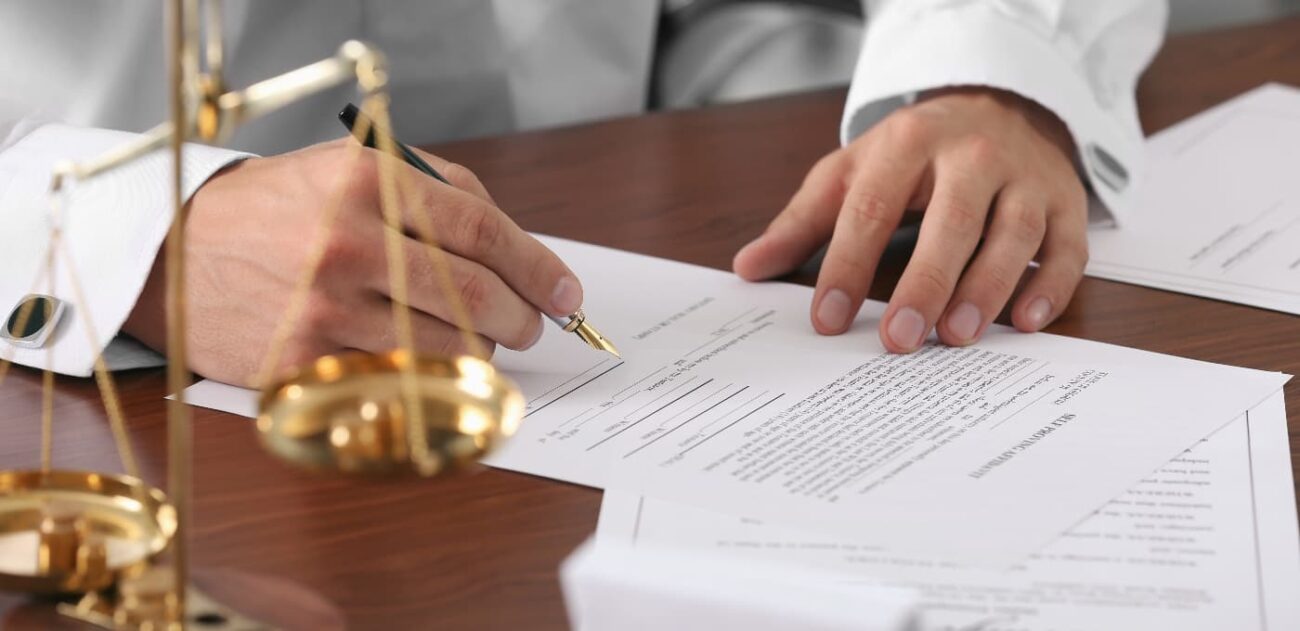 man signing will