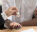 solicitor giving couple keys