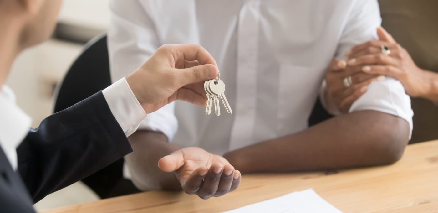 solicitor giving couple keys