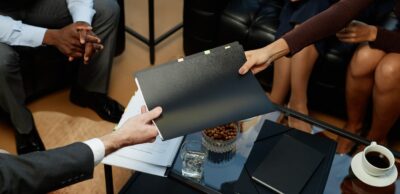business owners holding folder