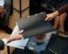 business owners holding folder