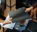 business owners holding folder