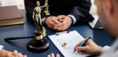 couple signing divorce papers