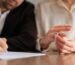 couple signing divorce papers