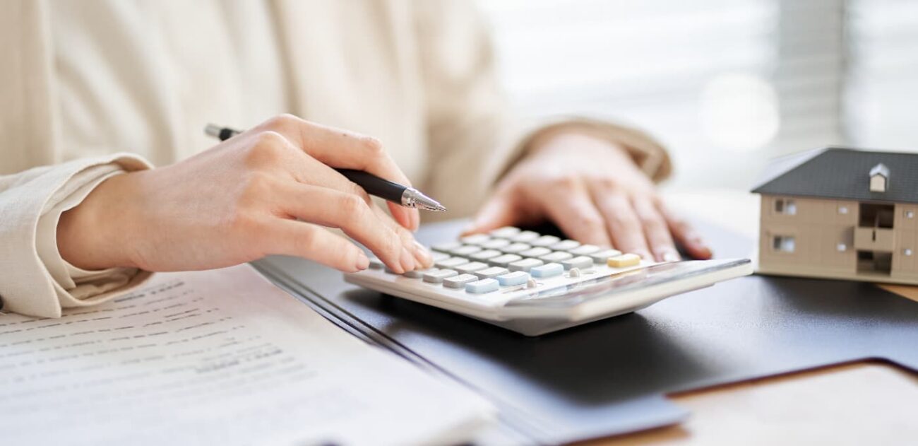 woman working out property tax with calculator