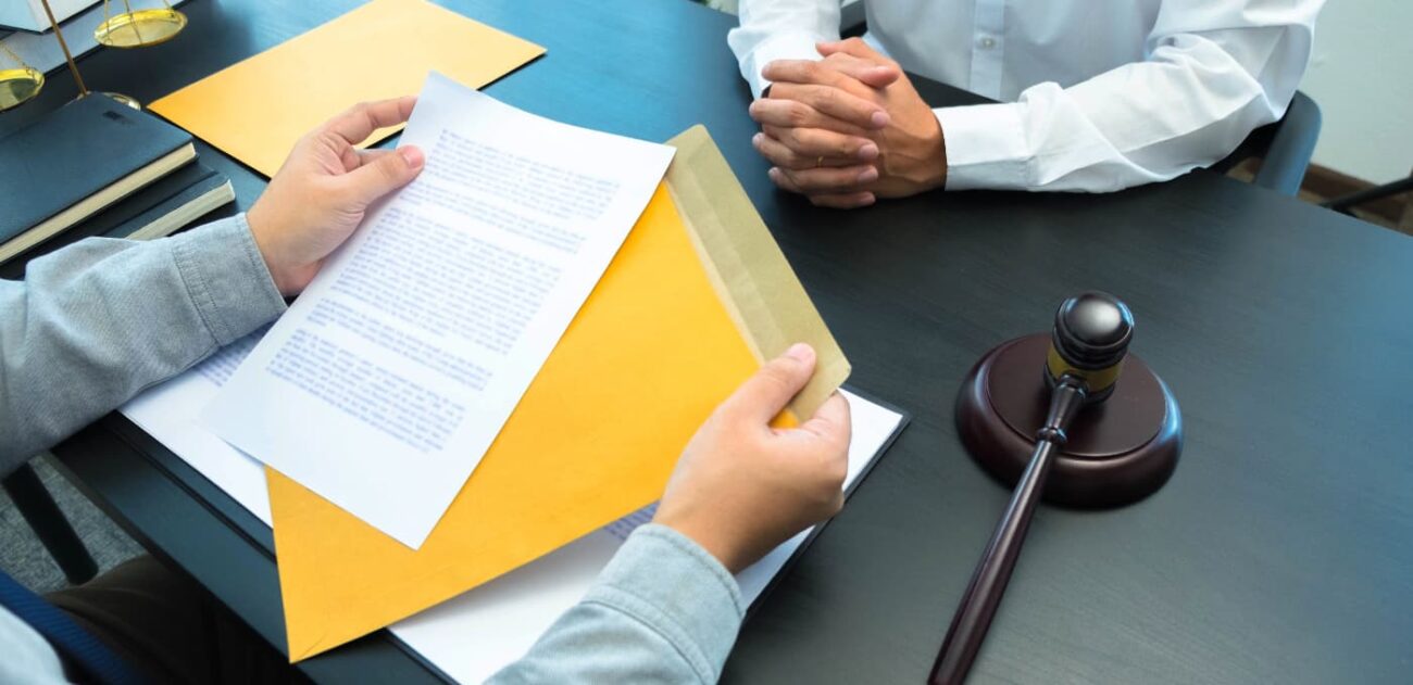 solicitor discussing documents with client